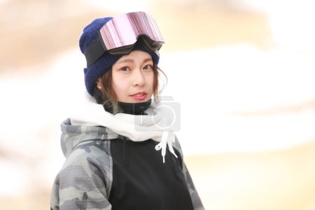 Image of a woman in snowboarding wear