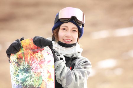Image of a woman in snowboarding wear
