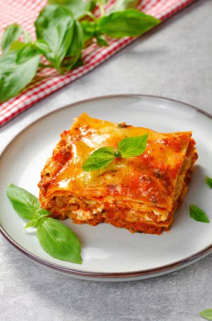 Delicious Homemade Lasagna with Bolognese Sauce on Bright Background, Italian Cuisine, Traditional Baked Lasagna