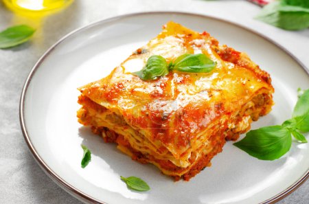 Delicious Homemade Lasagna with Bolognese Sauce on Bright Background, Italian Cuisine, Traditional Baked Lasagna