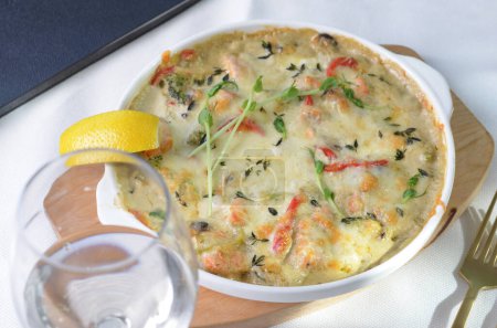 Baked Salmon Fillet in Creamy Sauce with Vegetables, Fish Pie, Casserole with Cheesy Topping