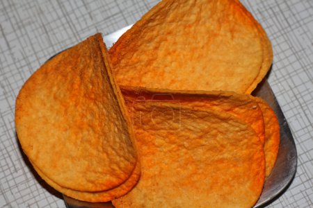Photo for Appetizing potato chips lie in a metal plate - Royalty Free Image