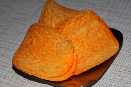 Photo for Appetizing potato chips lie in a metal plate - Royalty Free Image