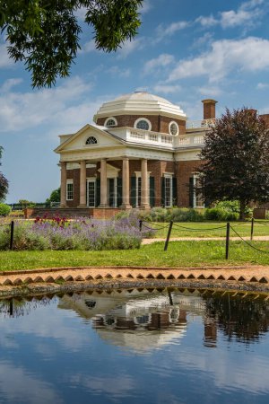 A photo of Monticello with a reflection on the pond out front
