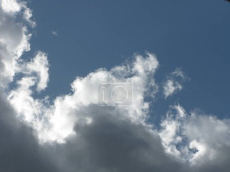 Photo for Cumulus gray and white clouds in a blue sky - Royalty Free Image