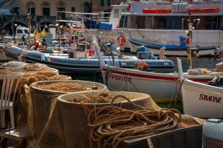 Photo for Italy, Camogli - February 17, 2015: fragment of the port and fishing gear and ropes and boats in the background in the small town of Camogli, Liguria, Italy - Royalty Free Image