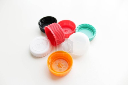 Several plastic bottle caps on white background