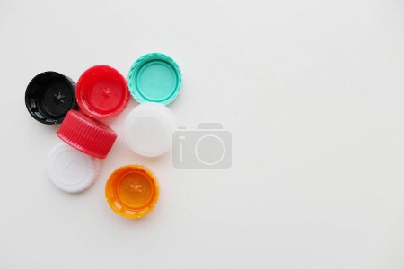 Plastic bottle caps on grey background