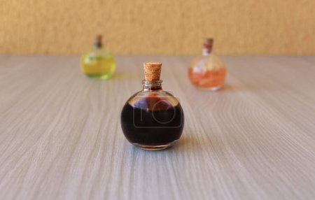 Three round bottles with magic potions for decoration or role-playing games