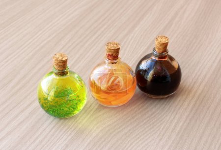 Three round bottles with magic potions for decoration or role-playing games