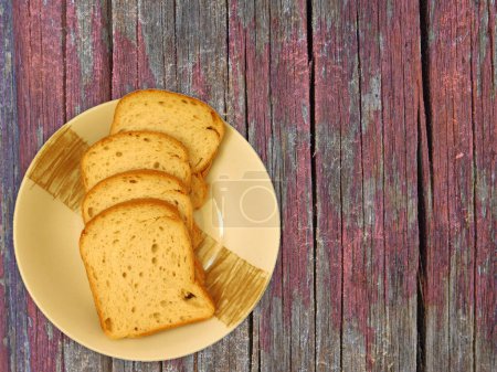 Photo for Sliced bread on wooden background - Royalty Free Image