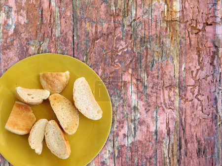 Photo for Sliced bread on wooden background - Royalty Free Image