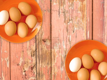 Photo for Eggs on the wooden background - Royalty Free Image