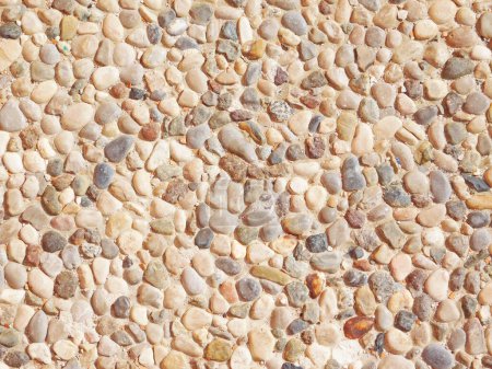 Téléchargez les photos : Gros plan sur la texture de pierre de galets pour le fond - en image libre de droit