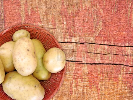 Photo for Raw potatoes on wooden background, top view - Royalty Free Image