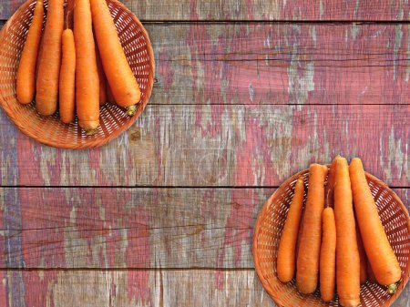 Photo for Close-up shot of Carrots On The Wooden Background - Royalty Free Image