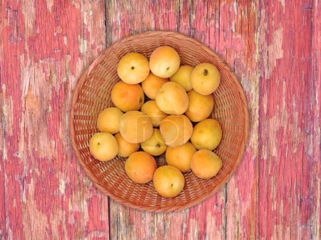 Photo for Close-up shot of Apricots On The Wooden Background - Royalty Free Image