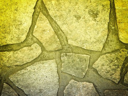 Photo for Close-up shot of yellow tinted stone texture for background - Royalty Free Image