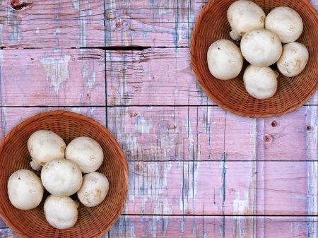 Photo for Mushrooms in bowls on the wooden background - Royalty Free Image