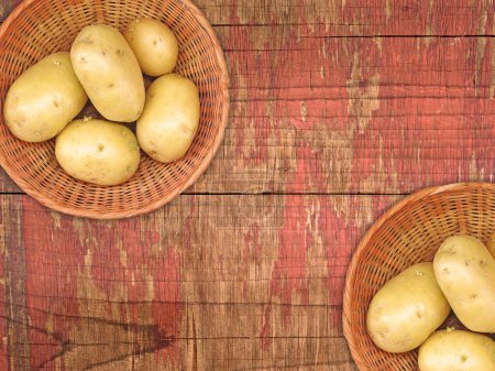 Photo for Raw potatoes on wooden background, top view - Royalty Free Image