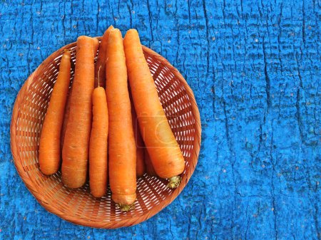 Photo for Close-up shot of Carrots On The Wooden Background - Royalty Free Image