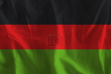 Photo for Malawi flag on wavy surface of fabric - Royalty Free Image
