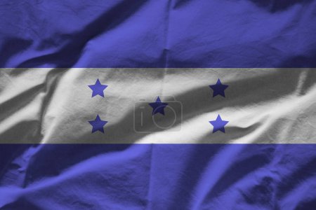 Téléchargez les photos : Drapeau Honduras sur la surface ondulée du tissu - en image libre de droit