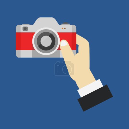 Illustration for Hand holding camera icon on blue background - Royalty Free Image