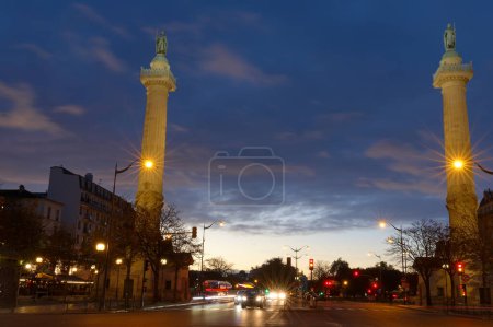 Photo for The two Doric columns erected in 1788 on Trone Avenue frame the entrance to Cours de Vincennes and Place de la Nation. Paris. France. - Royalty Free Image
