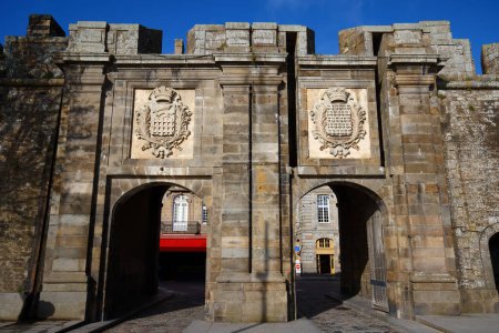 Photo for Fortification wall at Gate of Saint Vincent with closeup of coat of arms, in Saint Malo, Brittany, France. Inscription in Latin: Always faithful, Rather death than stain. - Royalty Free Image