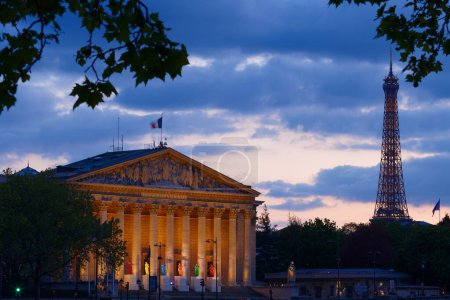 Photo for Paris, France-April 24, 2024 : The National Assembly- Bourbon Palace with six sculptures representing Olympism on its steps, to celebrate sport and art. The Eiffel Tower in the background. Paris. France. - Royalty Free Image