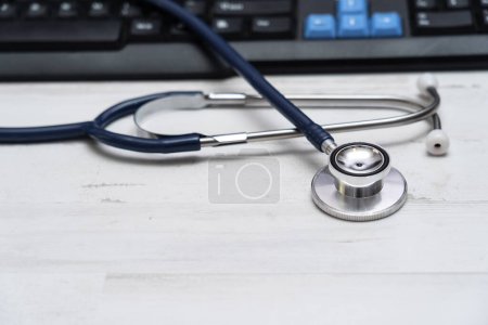 Foto de Stethoscope on white table of hospital family doctor, family medicine concept - Imagen libre de derechos