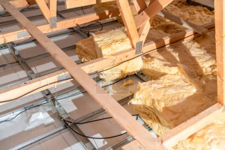 Photo for Glass wool for ceiling insulation on the roof. - Royalty Free Image