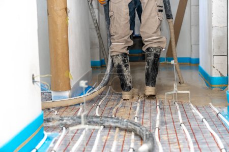 Photo for Covering the floor heating with anhydride and concrete. High quality photo - Royalty Free Image
