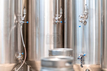 Photo for Stainless steel tanks for brewing beer in a brewery. High quality photo - Royalty Free Image