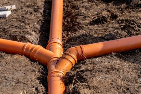 Photo for Sewage system made of plastic PVC pipes in the ground. - Royalty Free Image