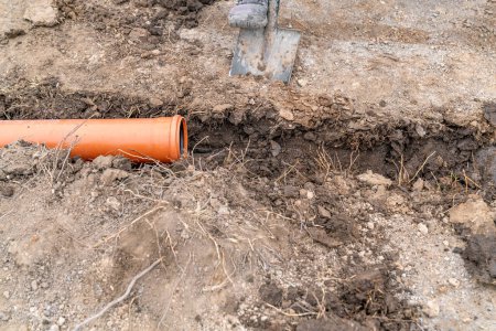 plastic pvc waste sewer pipe in the ground. High quality photo