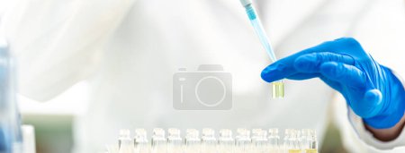 Photo for Pipetting a chemical sample into research flasks. High quality photo - Royalty Free Image