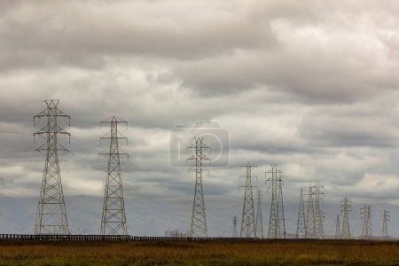 Photo for High Voltage Power Lines with Storm Clouds Approaching. Palo Alto Baylands, Bay Area, California. - Royalty Free Image