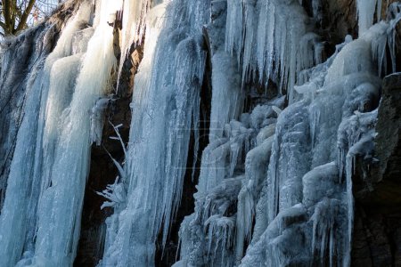 amazing frozen waterfal with beautiful icycles in winter