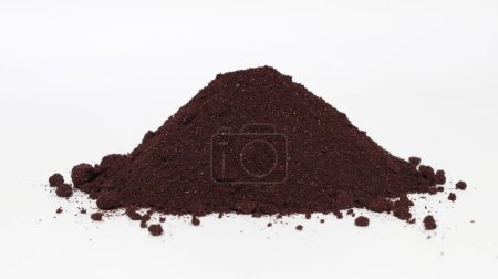 Photo for Aronia berries powder spilled in a small pile. - Royalty Free Image