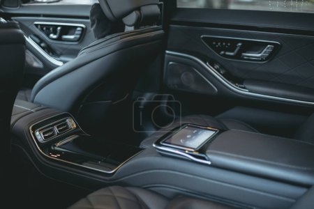 Beautiful dark grey colored interior of a luxurious car from natural leather.
