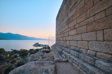 Photo for Bafa, Turkey - July 15, 2023: The ruins of ancient city of Herakleia and Latmos Athena temple located on the shore of Lake Bafa - Royalty Free Image
