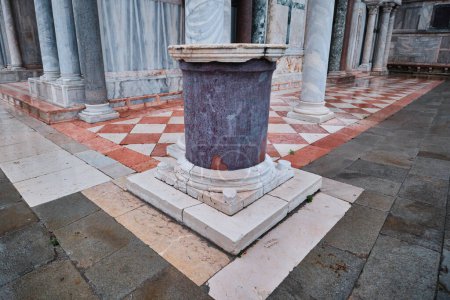 Photo for Venice, Italy - November 9 2023: A porphyry column taken from Constantinople during the Fourth Crusade, and now exhibited in front of the Basilica di San Marco - Royalty Free Image
