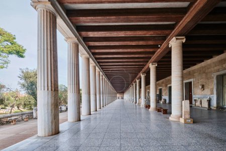 Photo for Athens, Greece - March 03, 2024: Stoa of Attalos in Ancient Agora of Athens, white doric marble colonnade and wooden ceiling of ancient greek architecture - Royalty Free Image