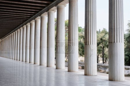 Photo for Athens, Greece - March 03, 2024: Stoa of Attalos in Ancient Agora of Athens, white doric marble colonnade and wooden ceiling of ancient greek architecture - Royalty Free Image