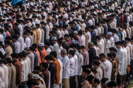 Photo for Muslim community carry out the Eid prayer 1444 H on April 21, 2023 at Sempur Field, Bogor, West Java, Indonesia - Royalty Free Image