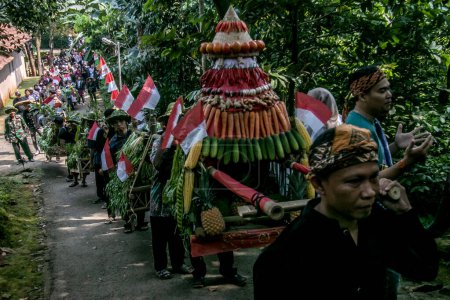 Photo for Bogor City, Indonesia - July 23, 2023 - Residents do a procession by bringing natural products from agriculture and plantations called the earth alms tradition - Royalty Free Image