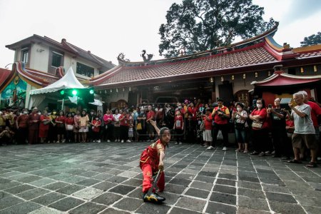 Photo for Bogor, Indonesia - August 10, 2023: A woman demonstrates the Wushu martial art at the Sejit celebration of YM Kongco Kwan Kong at the Dhanagun Vihara, Bogor, West Java, Indonesia - Royalty Free Image