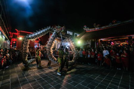 Photo for Bogor, Indonesia - August 10, 2023: Dragon dance performance at YM Kongco Kwan Kong's Sejit celebration at Dhanagun Vihara, Bogor, West Java, Indonesia - Royalty Free Image
